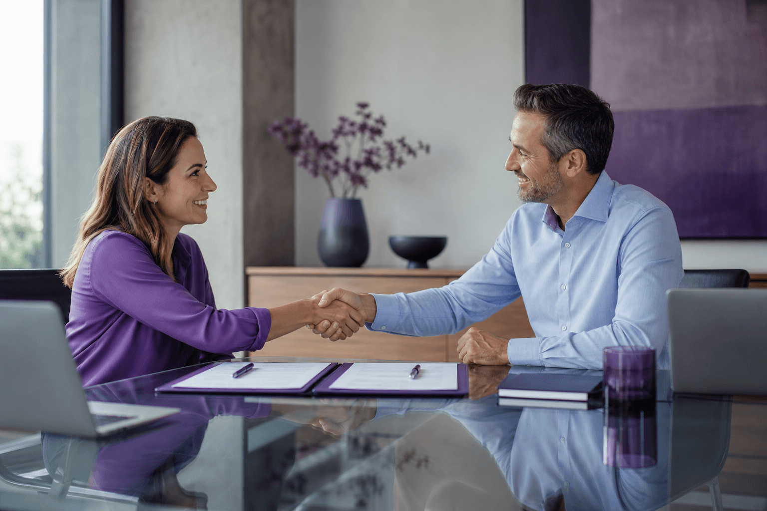 Business partners shaking hands after a strategic alliance meeting